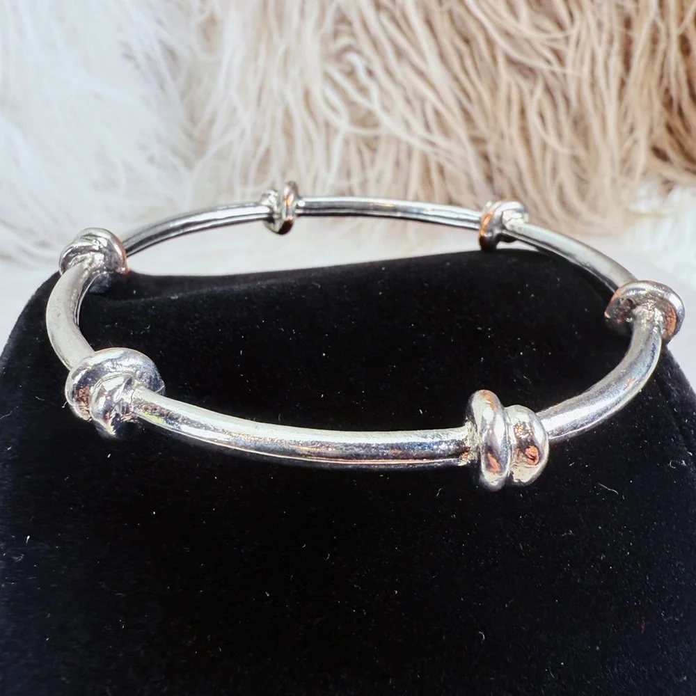 Pretty Silvertone weighted knotted bangle stacking bracelet